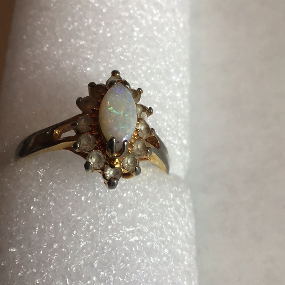 Elegant Opal and Diamond Ring in Gold Setting